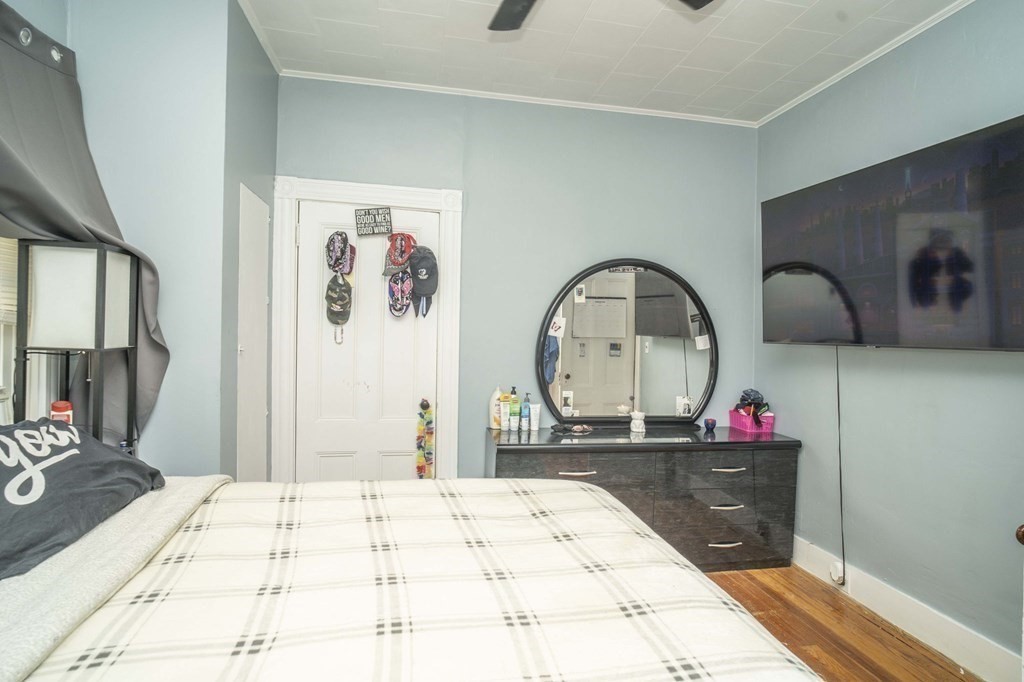 5 Exeter Street Taunton, MA 02780 - Photo 11 of 32 a bed sitting in a bedroom and a mirror