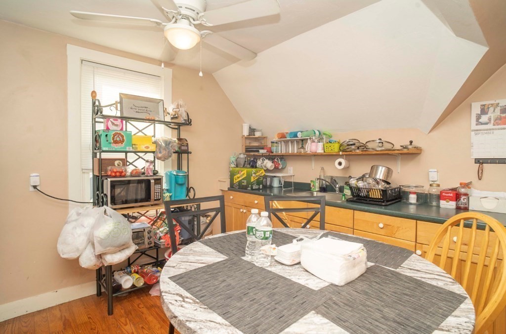 5 Exeter Street Taunton, MA 02780 - Photo 13 of 32 a living room with furniture a fireplace and next to a window