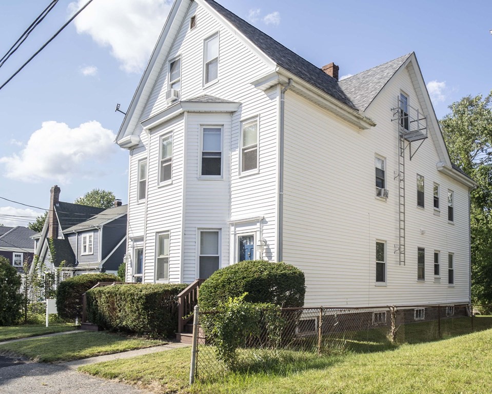 5 Exeter Street Taunton, MA 02780 - Photo 2 of 32 a front view of a house with a yard