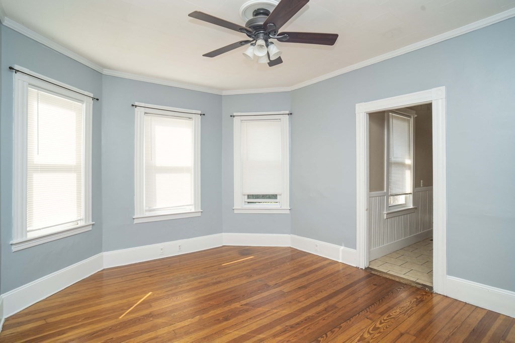 5 Exeter Street Taunton, MA 02780 - Photo 21 of 32 a view of a livingroom with a window and wooden floor
