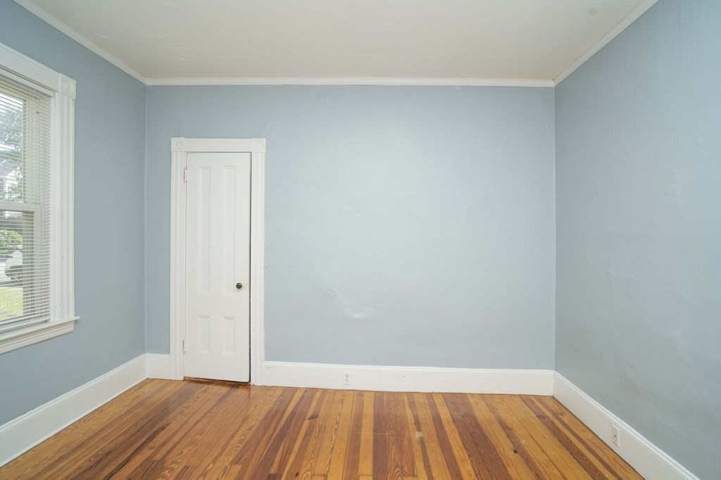 5 Exeter Street Taunton, MA 02780 - Photo 22 of 32 a view of an empty room with wooden floor and a window