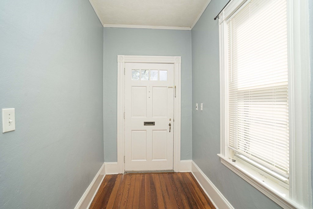 5 Exeter Street Taunton, MA 02780 - Photo 26 of 32 a view of a hallway with wooden floor and a window
