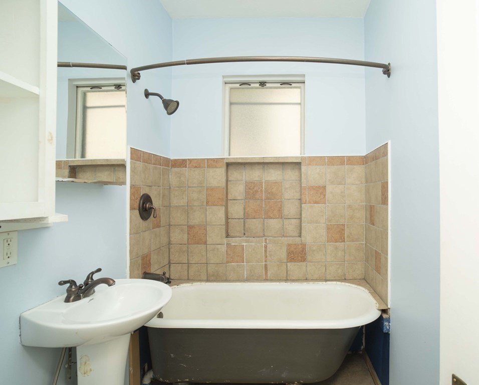 5 Exeter Street Taunton, MA 02780 - Photo 28 of 32 a bathroom with a sink and a bathtub