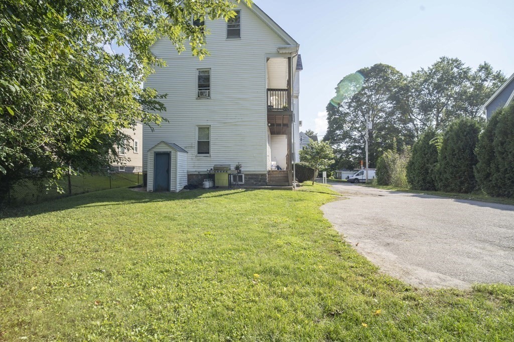 5 Exeter Street Taunton, MA 02780 - Photo 30 of 32 a view of a house with backyard and tree