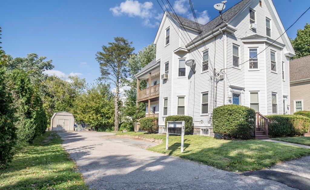 5 Exeter Street Taunton, MA 02780 - Photo 3 of 32 a view of a patio with a table and chairs and potted plants