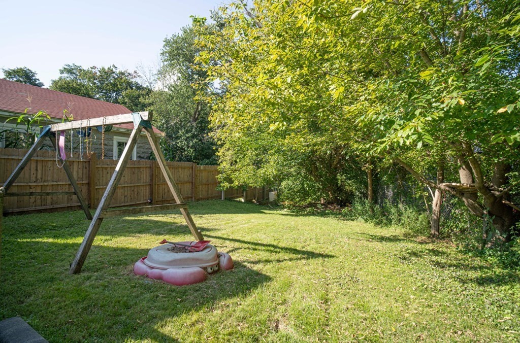 5 Exeter Street Taunton, MA 02780 - Photo 31 of 32 a view of a backyard with a fountain