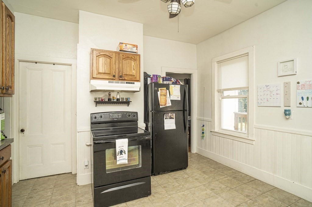 5 Exeter Street Taunton, MA 02780 - Photo 7 of 32 a view of a kitchen with an oven and refrigerator