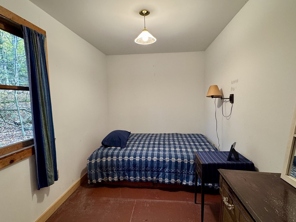 246 S Road Heath, MA 01346 - Photo 8 of 14 a bedroom with a bed and wooden floor