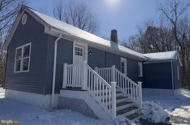 a view of a porch with wooden stairs and stairs