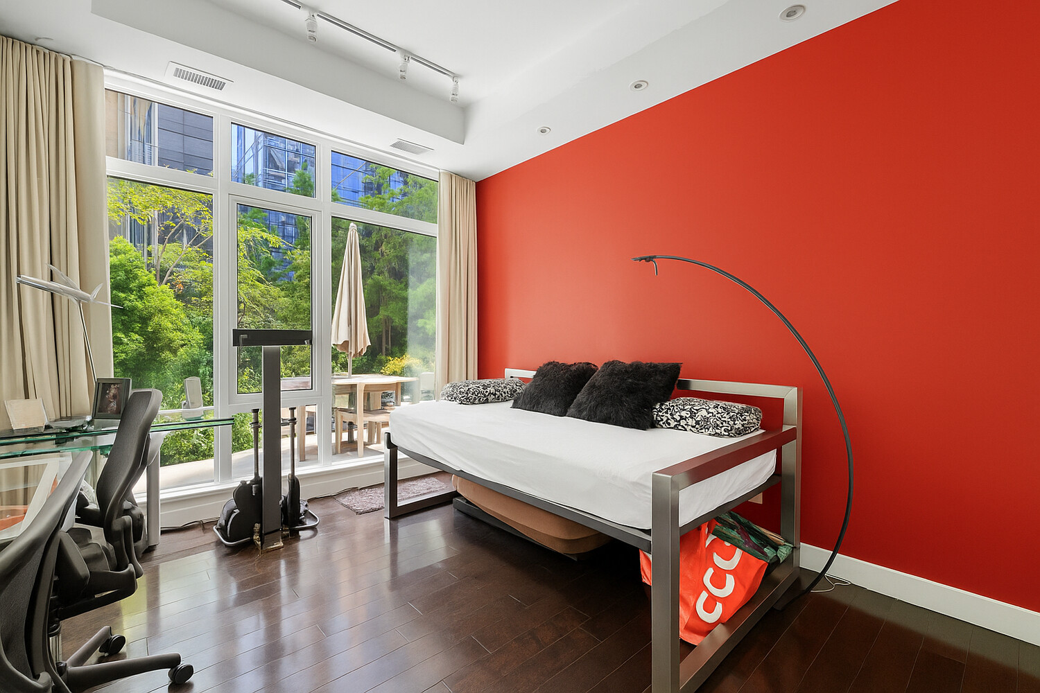 111 Fulton Street, Unit PH111 Manhattan, NY 10038 - Photo 9 of 12 a living room with furniture and floor to ceiling windows