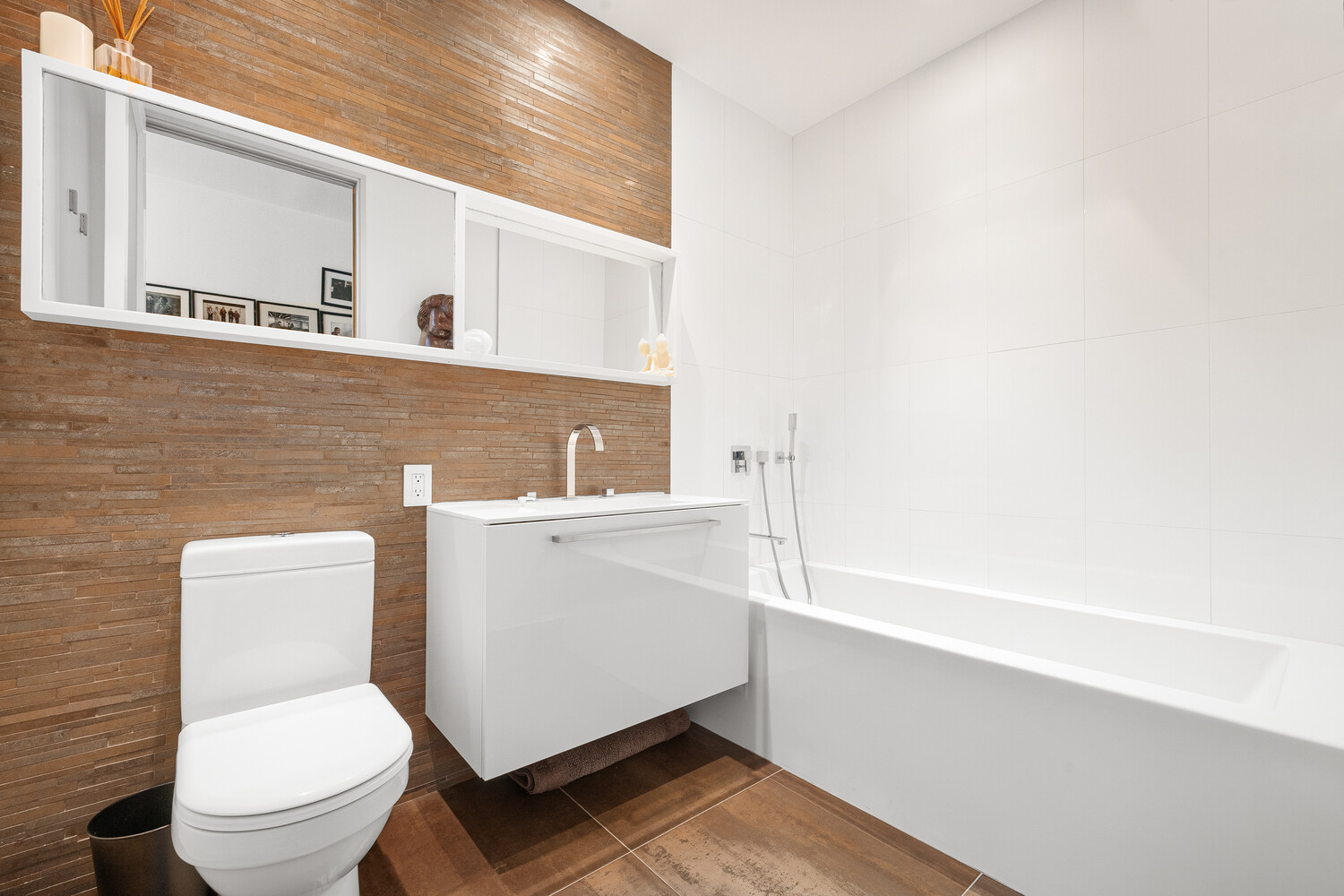 111 Fulton Street, Unit PH111 Manhattan, NY 10038 - Photo 10 of 12 a white toilet sitting next to a bathroom sink