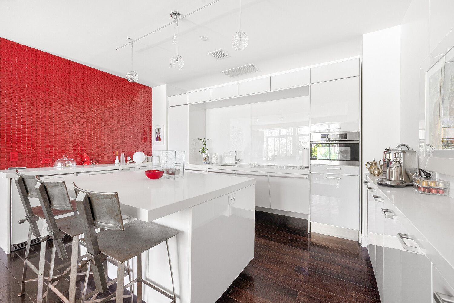 111 Fulton Street, Unit PH111 Manhattan, NY 10038 - Photo 6 of 12 a kitchen with a dining table chairs sink and cabinets
