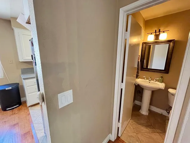 a bathroom with a sink and mirror