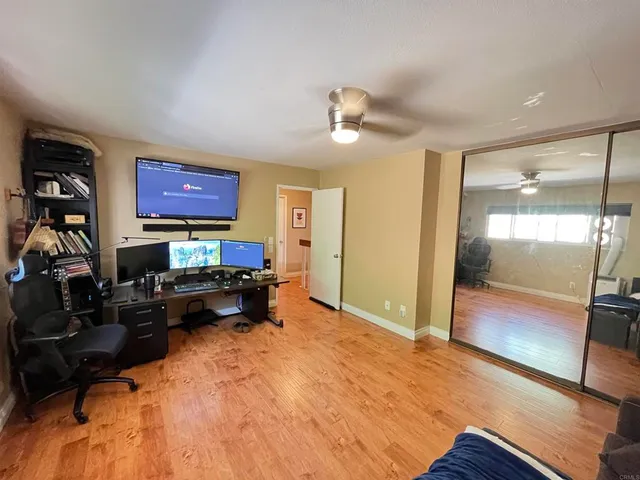 a bed room with a bed and a television