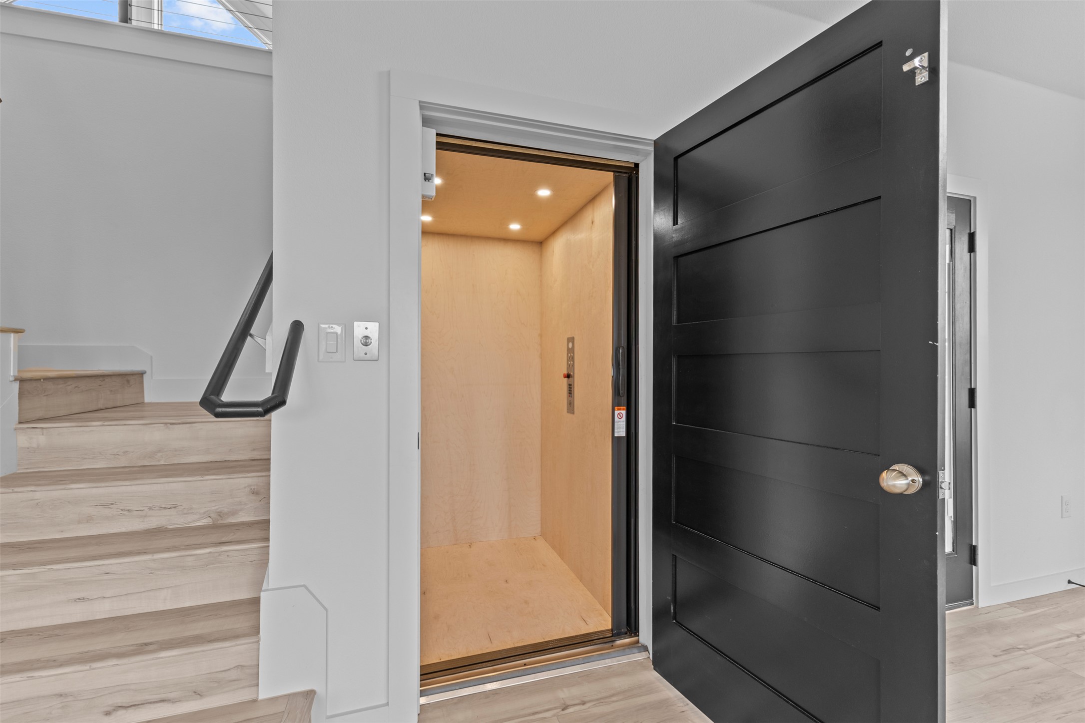11005 Beach Road Leander, TX 78641 - Photo 24 of 40 Elevator with wood finished floors