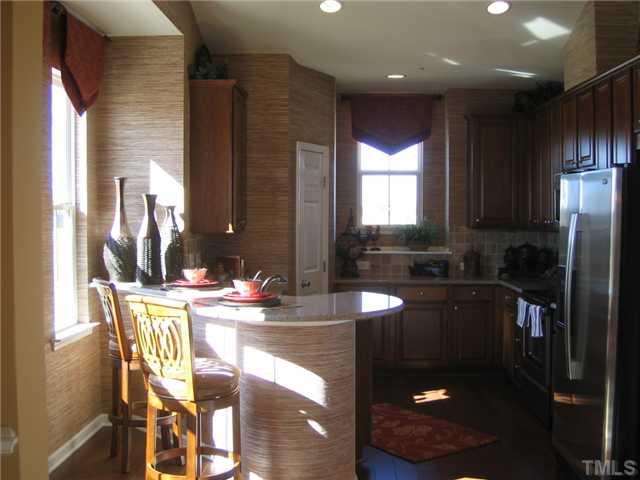 8331 Yaxley Hall Drive, Unit 628 Raleigh, NC 27616 - Photo 3 of 11 MODEL PICTURE- Gorgeous kitchen with plenty of windows and counterspace