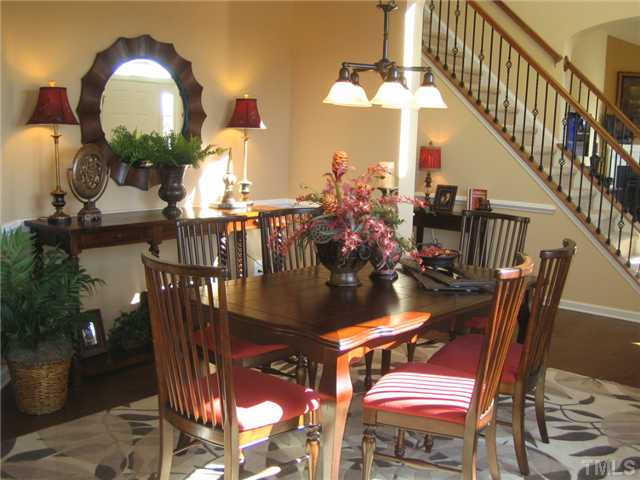 8331 Yaxley Hall Drive, Unit 628 Raleigh, NC 27616 - Photo 4 of 11 MODEL PICTURE- Formal dining is conveniently centered between kitchen and family room- perfect for entertaining!