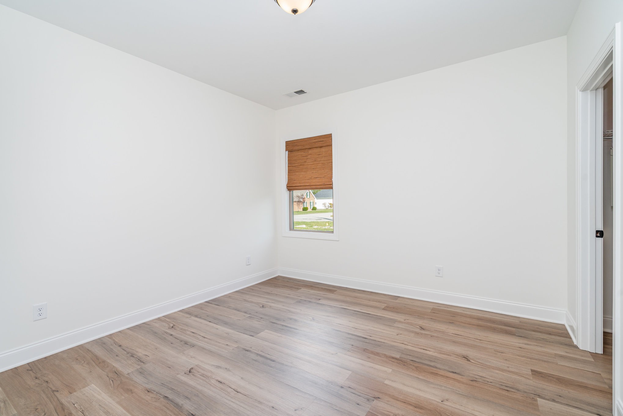 412 West Foxrun Springfield, TN 37172 - Photo 15 of 23 an empty room with wooden floor and windows
