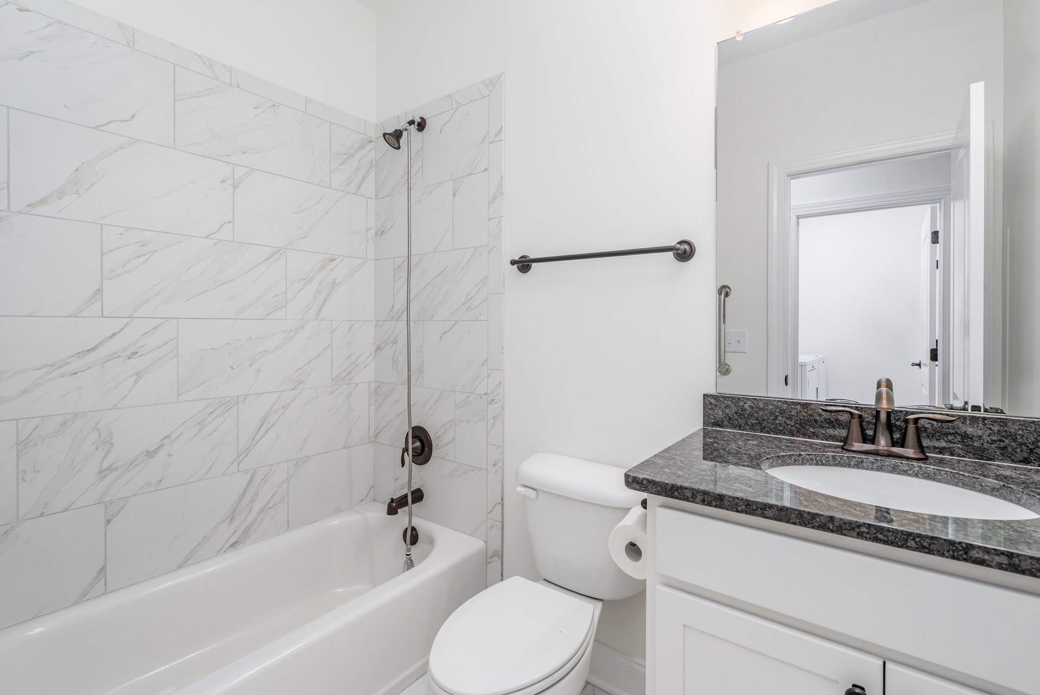 412 West Foxrun Springfield, TN 37172 - Photo 19 of 23 a bathroom with a granite countertop sink toilet and shower