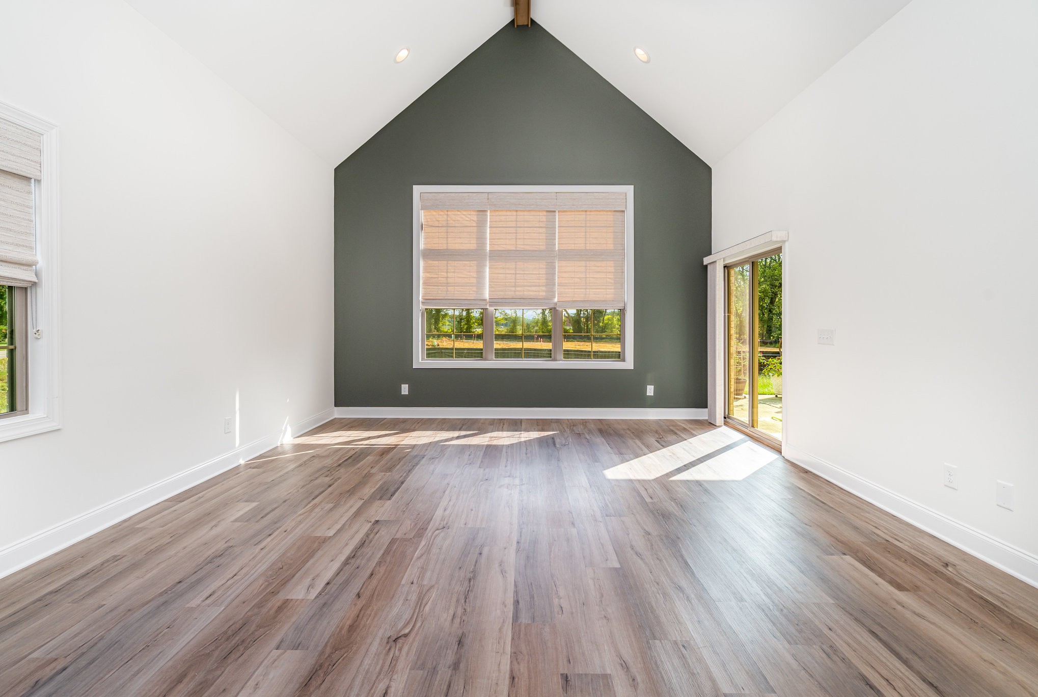 412 West Foxrun Springfield, TN 37172 - Photo 4 of 23 an empty room with wooden floor and windows
