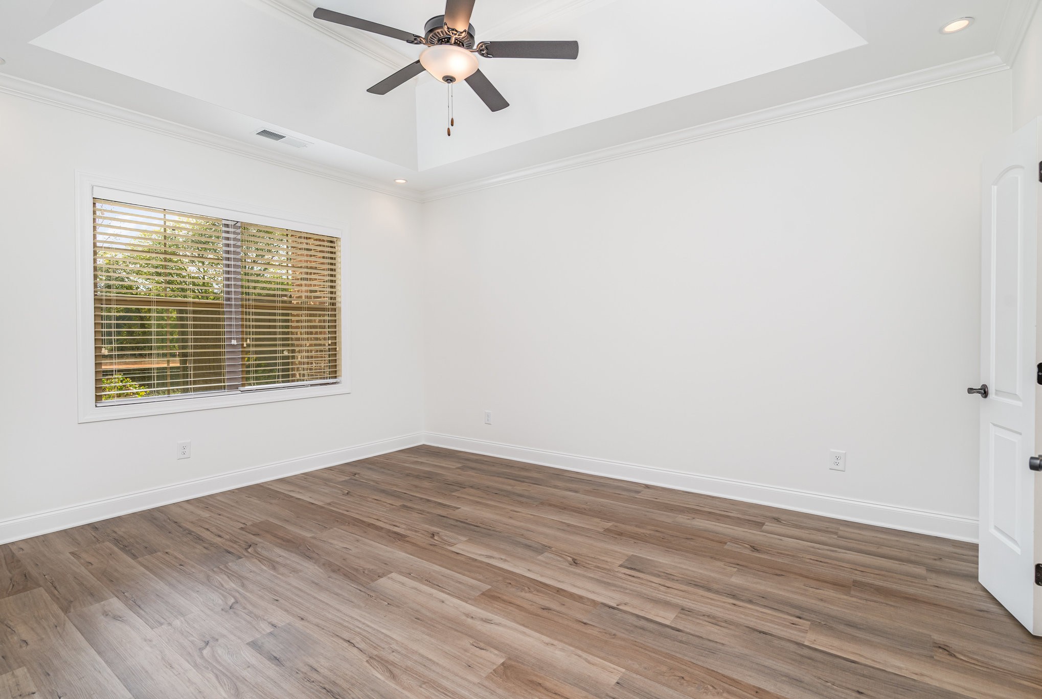 412 West Foxrun Springfield, TN 37172 - Photo 9 of 23 a view of an empty room with wooden floor and a window