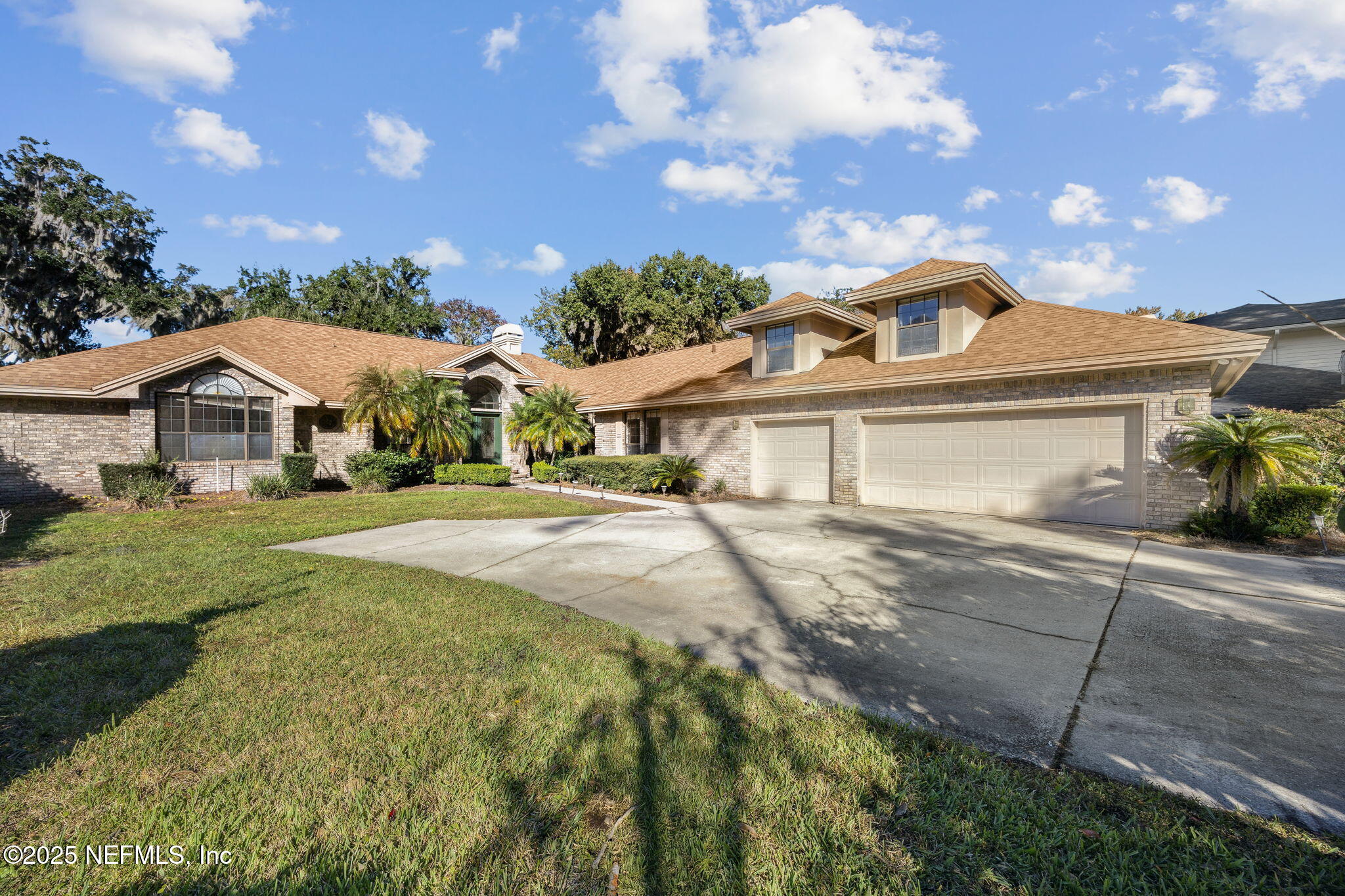 13050 Mandarin Road Jacksonville, FL 32223 - Photo 8 of 82 a front view of a house with garden