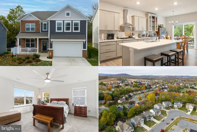 a kitchen with stainless steel appliances kitchen island granite countertop a refrigerator and cabinets
