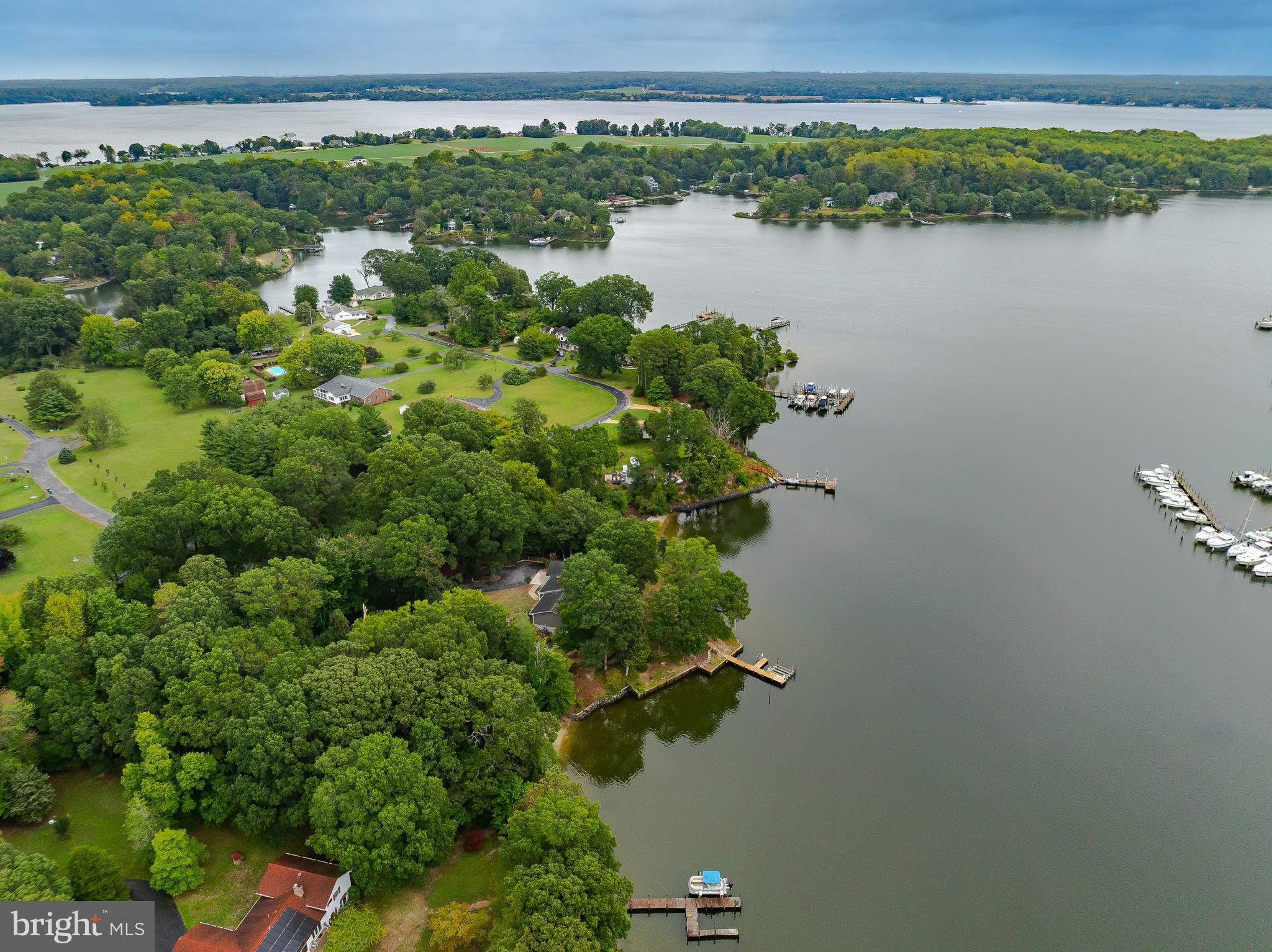 44973 Smiths Nursery Road Hollywood, MD 20636 - Photo 16 of 111 a view of a lake with a building in the background