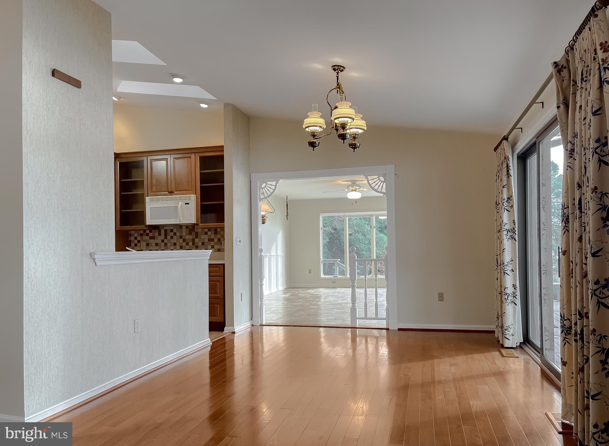 44973 Smiths Nursery Road Hollywood, MD 20636 - Photo 62 of 111 an empty room with wooden floor and windows