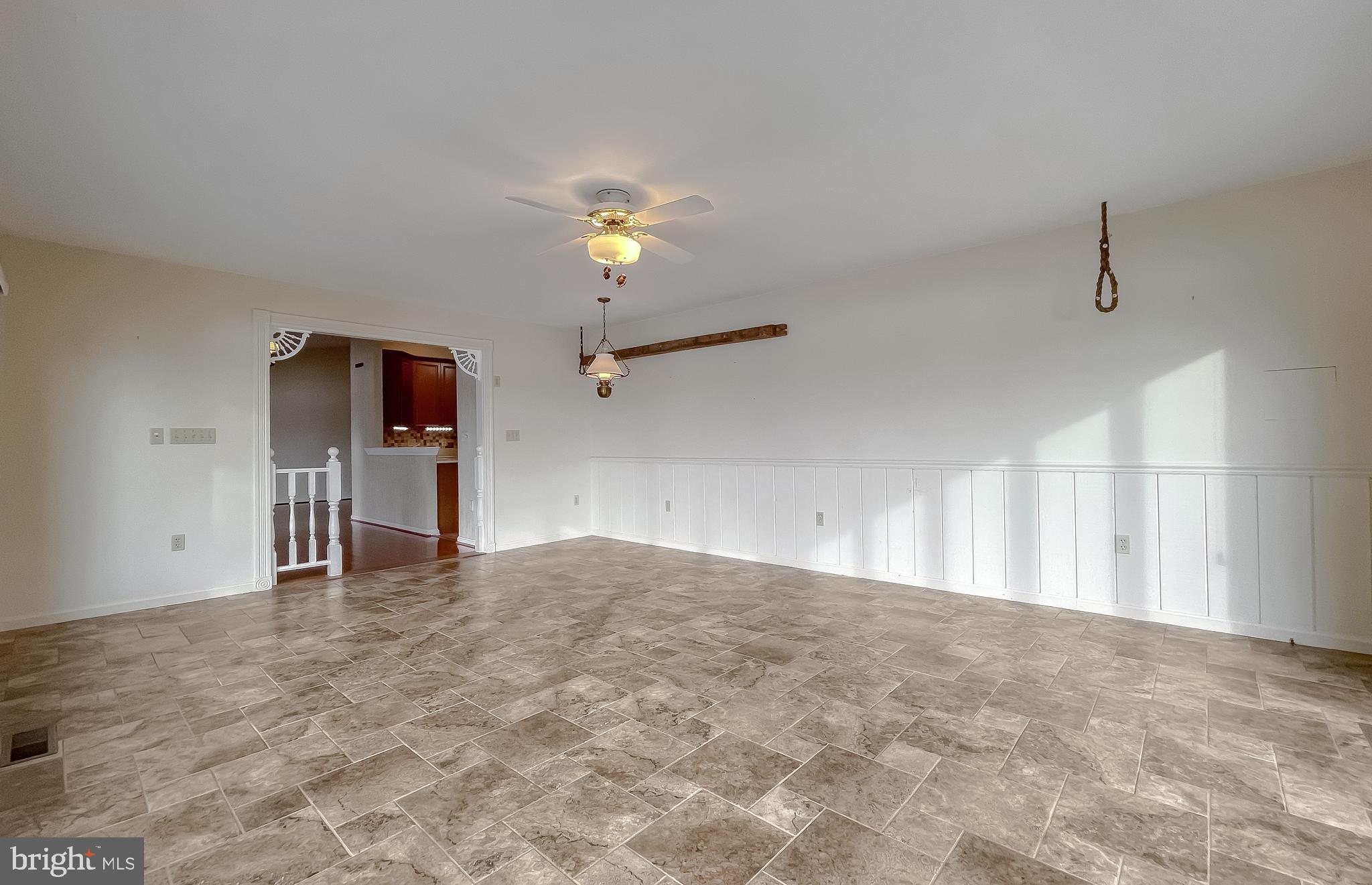 44973 Smiths Nursery Road Hollywood, MD 20636 - Photo 68 of 111 a view of an empty room with a window and kitchen view