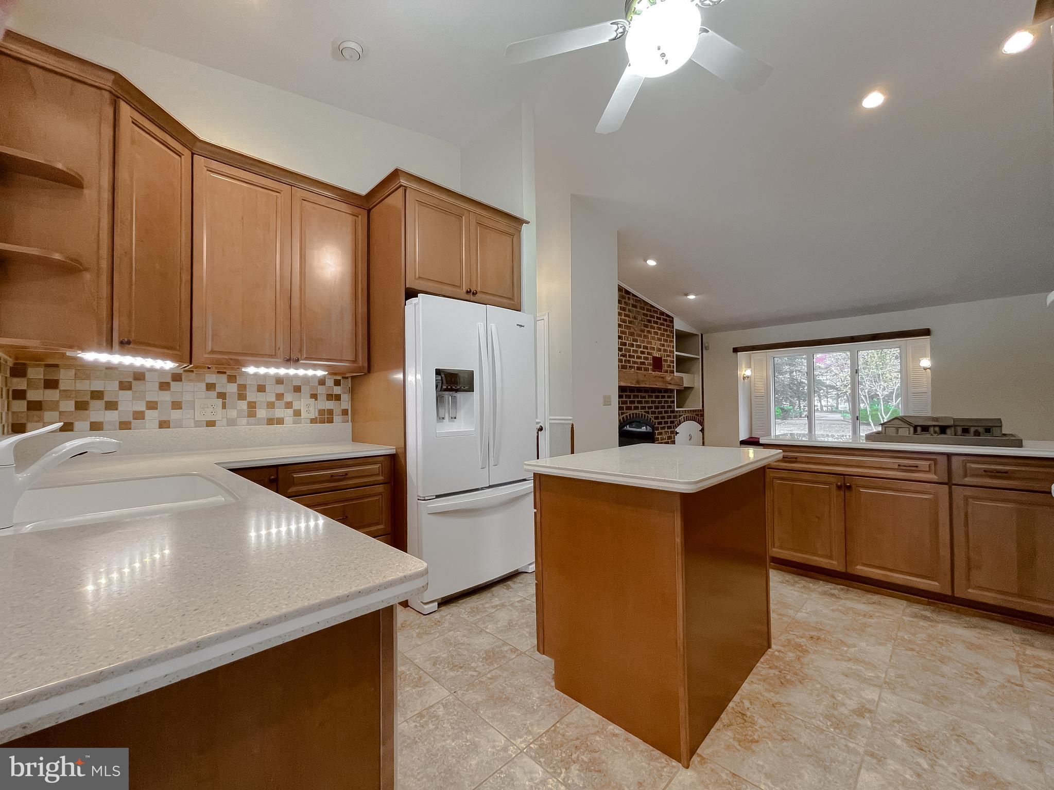 44973 Smiths Nursery Road Hollywood, MD 20636 - Photo 78 of 111 a kitchen with stainless steel appliances kitchen island granite countertop a sink counter space cabinets and a stove