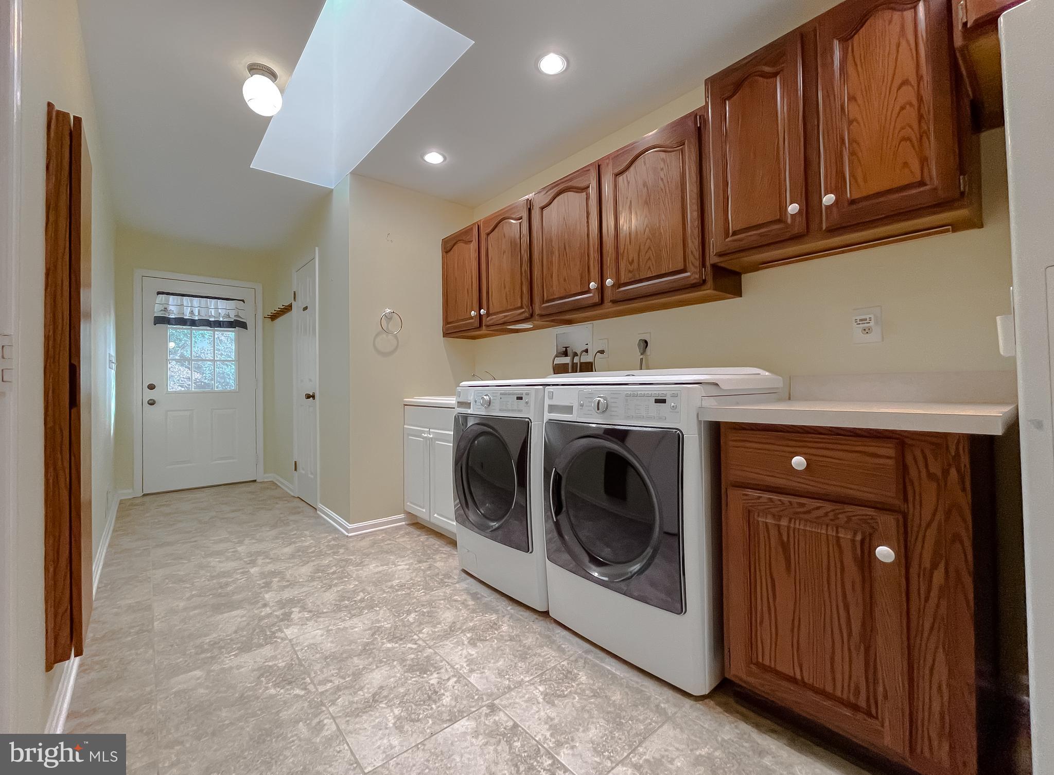 44973 Smiths Nursery Road Hollywood, MD 20636 - Photo 82 of 111 a utility room with sink dryer and washer