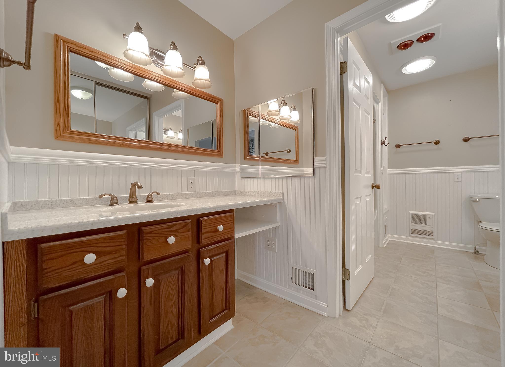 44973 Smiths Nursery Road Hollywood, MD 20636 - Photo 98 of 111 a bathroom with a sink vanity and a mirror