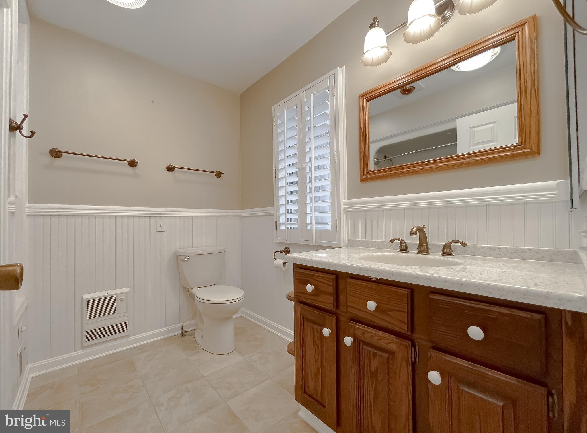 44973 Smiths Nursery Road Hollywood, MD 20636 - Photo 100 of 111 a bathroom with a granite countertop toilet sink and mirror