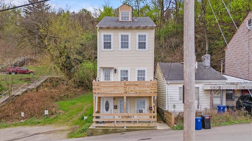 852 Windom Street Pittsburgh, PA 15203 - Photo 1 of 44 a front view of a house with a yard