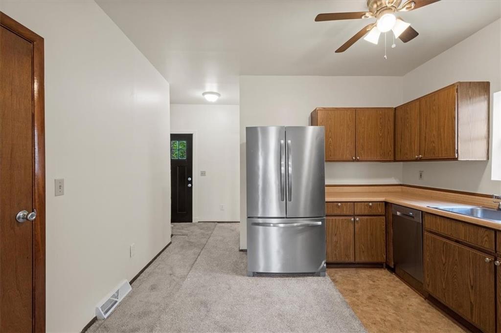 852 Windom Street Pittsburgh, PA 15203 - Photo 19 of 44 a kitchen with a refrigerator and a sink