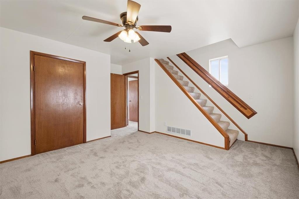 852 Windom Street Pittsburgh, PA 15203 - Photo 24 of 44 an empty room with ceiling fan and wooden floor