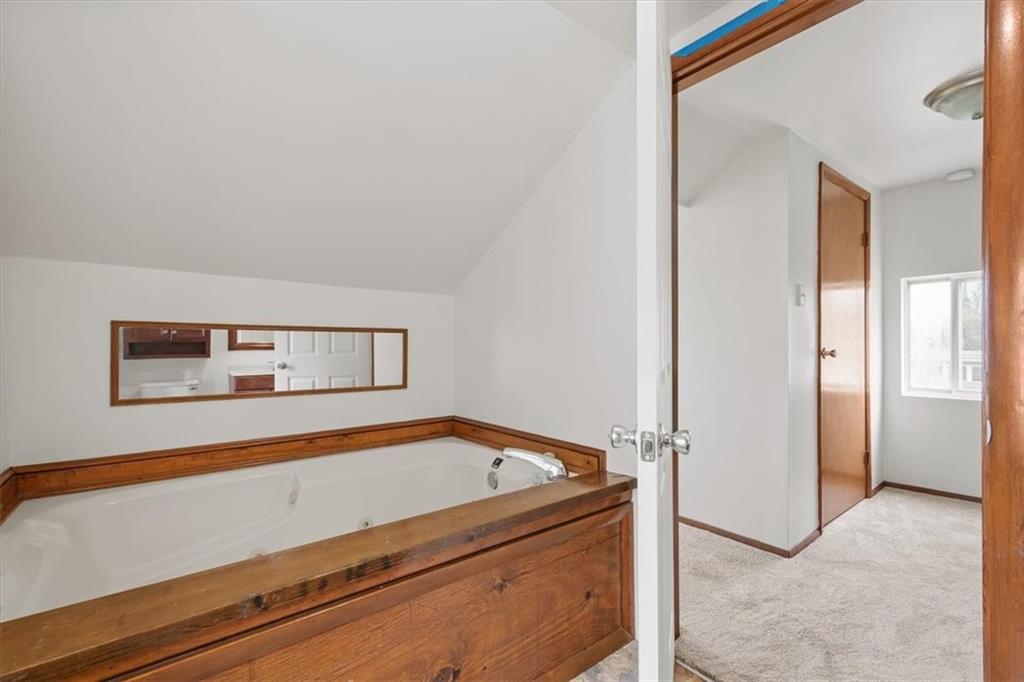 852 Windom Street Pittsburgh, PA 15203 - Photo 29 of 44 a room with a bed and a painting on the wall