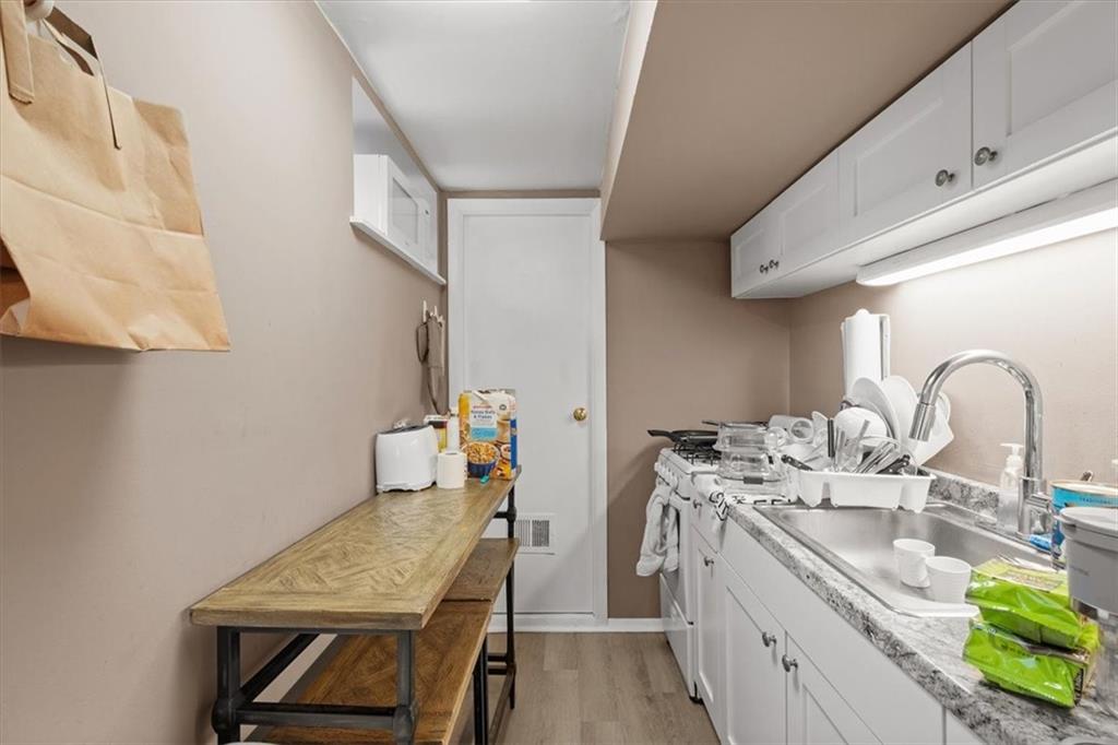 852 Windom Street Pittsburgh, PA 15203 - Photo 36 of 44 a room with a sink and cabinets