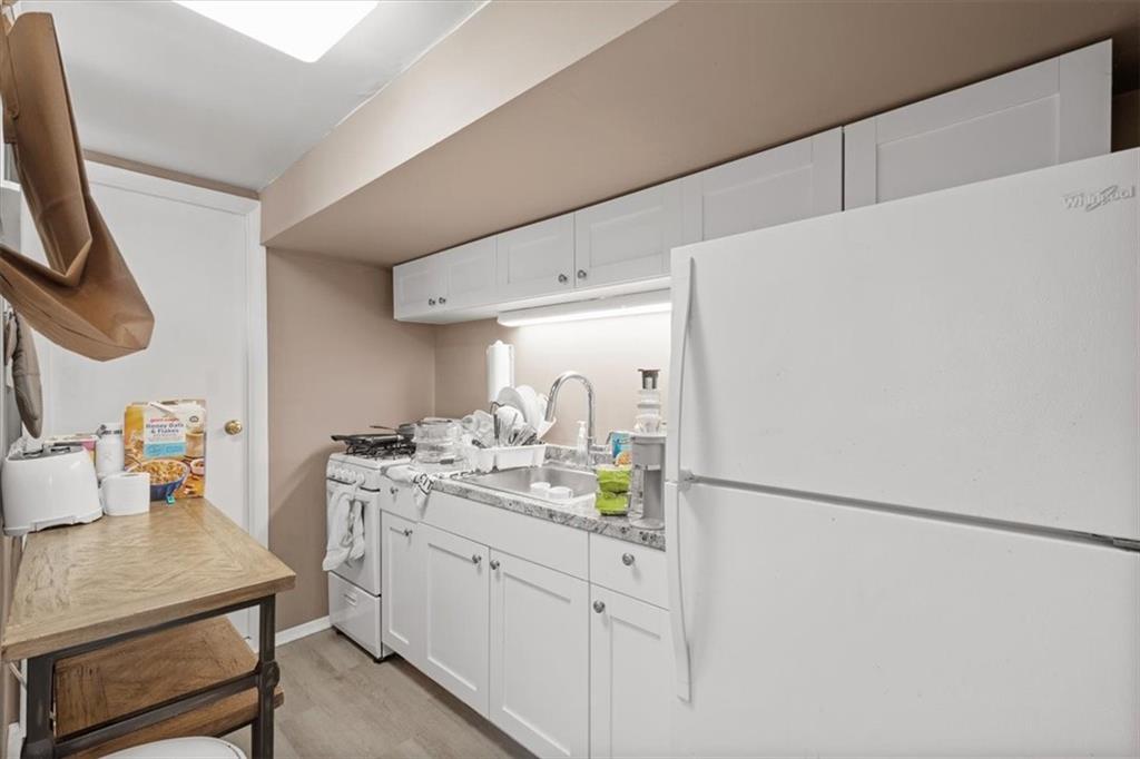 852 Windom Street Pittsburgh, PA 15203 - Photo 37 of 44 a kitchen with a sink cabinets and appliances