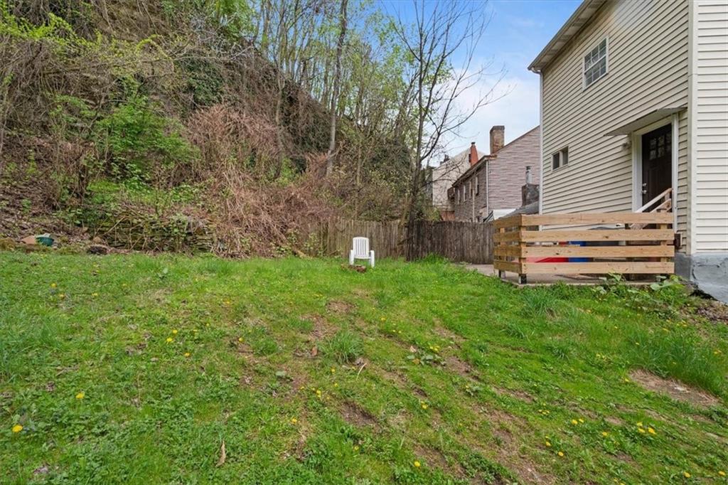 852 Windom Street Pittsburgh, PA 15203 - Photo 41 of 44 a front view of a house with a yard