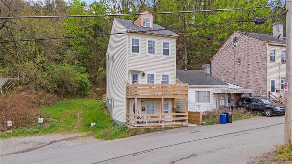 852 Windom Street Pittsburgh, PA 15203 - Photo 44 of 44 an aerial view of a house with a yard