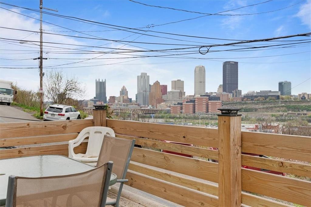 852 Windom Street Pittsburgh, PA 15203 - Photo 9 of 44 a view of a balcony with a table and chairs
