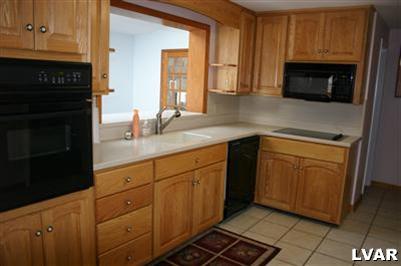 2710 Woodside Road Bethlehem, PA 18017 - Photo 4 of 24 Ultra Modern Kitchen - Ceramic floor, Corian Countertop, newer fixtures
