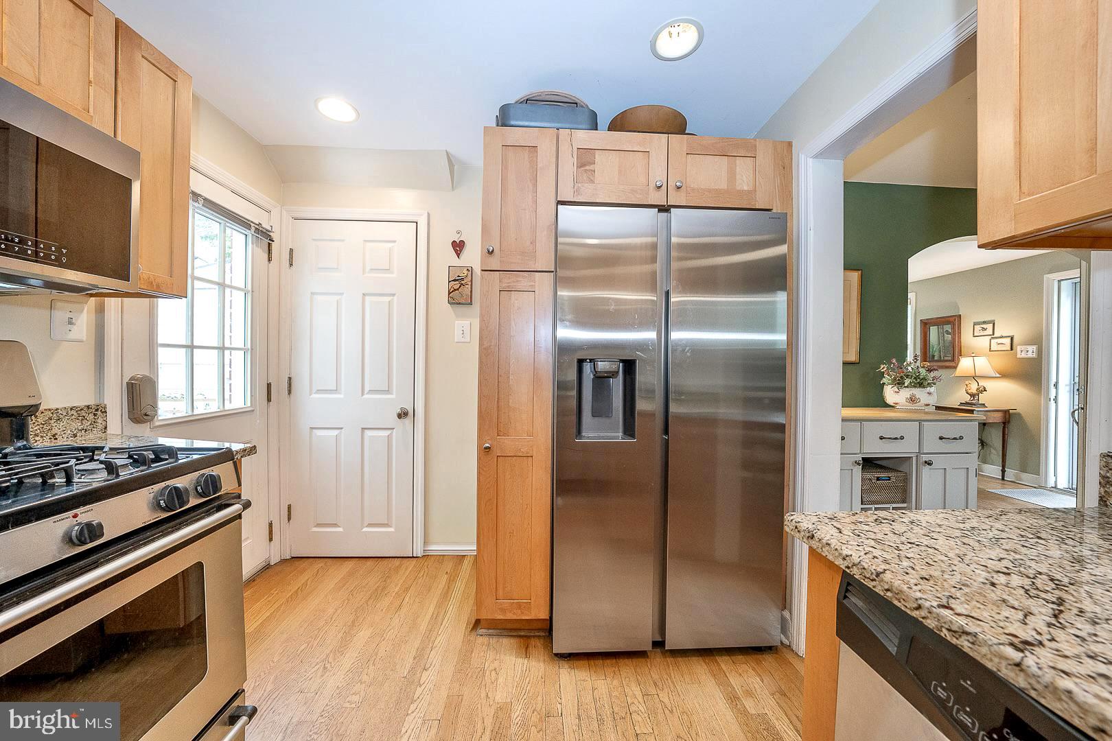 305 Eagle Road Wayne, PA 19087 - Photo 14 of 43 a kitchen with stainless steel appliances granite countertop a refrigerator and a stove