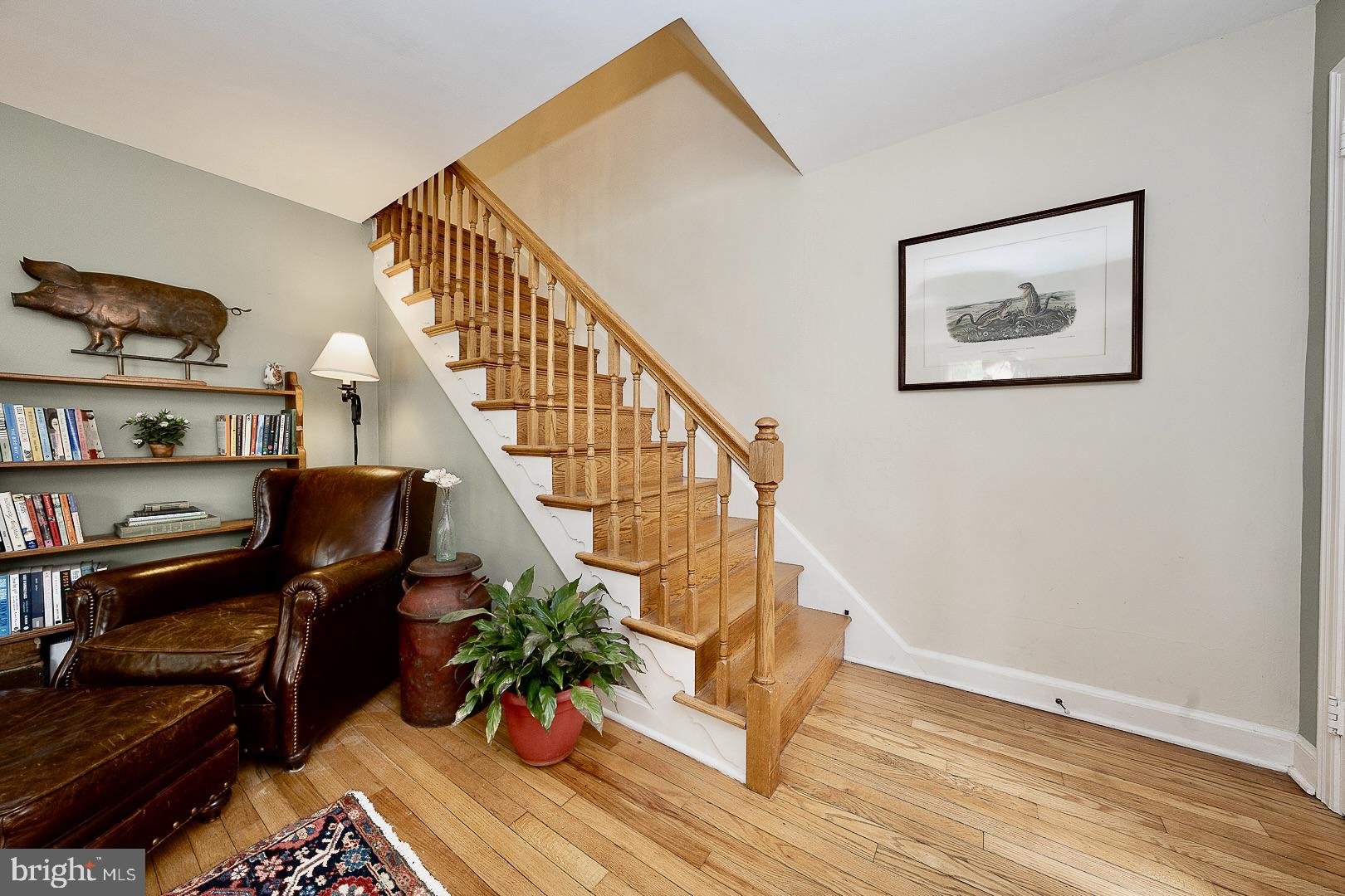 305 Eagle Road Wayne, PA 19087 - Photo 17 of 43 a view of a hallway with wooden floor and a workspace