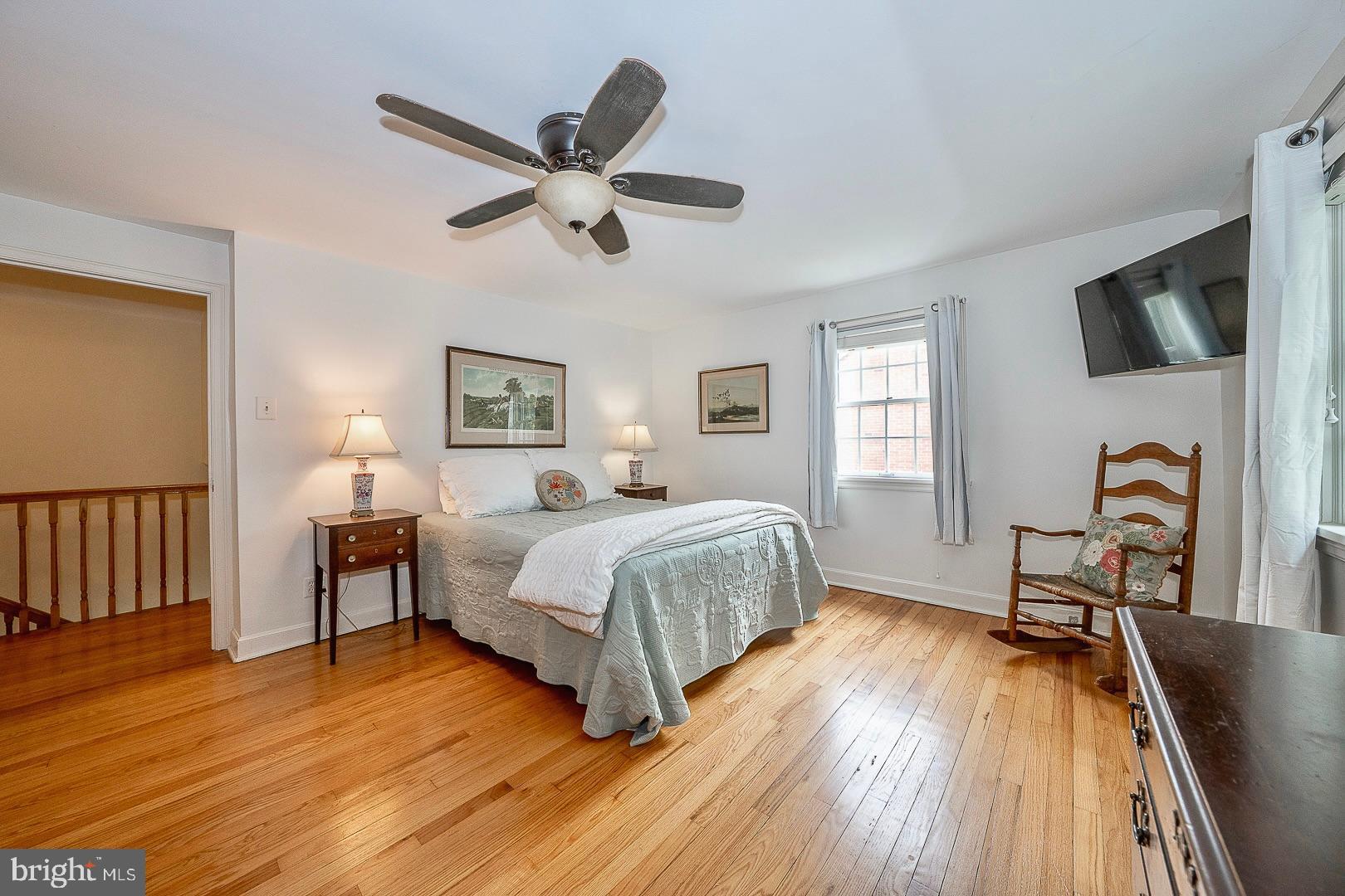 305 Eagle Road Wayne, PA 19087 - Photo 21 of 43 a spacious bedroom with a bed a window and flat screen tv