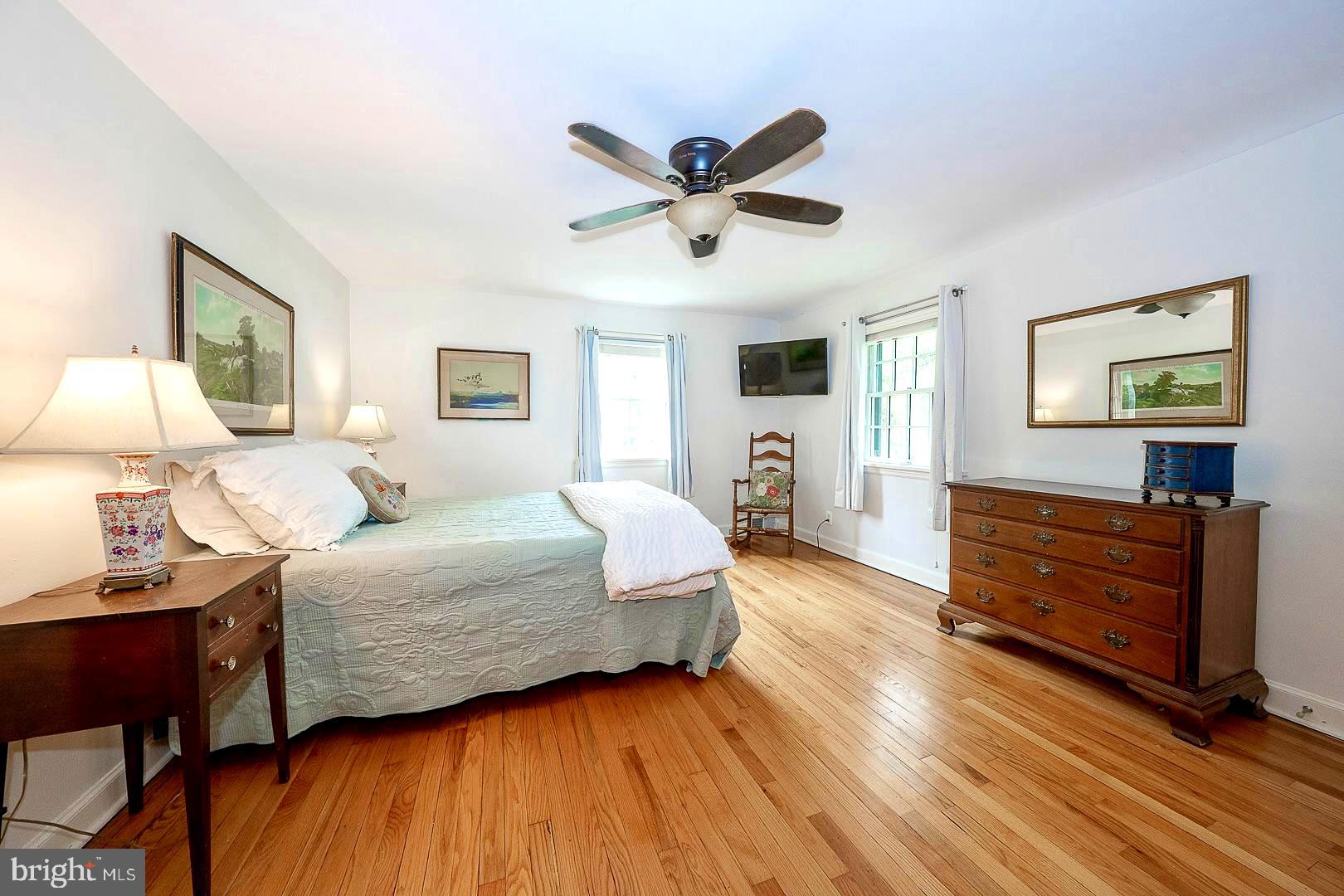 305 Eagle Road Wayne, PA 19087 - Photo 23 of 43 a bedroom with a bed and wooden floor