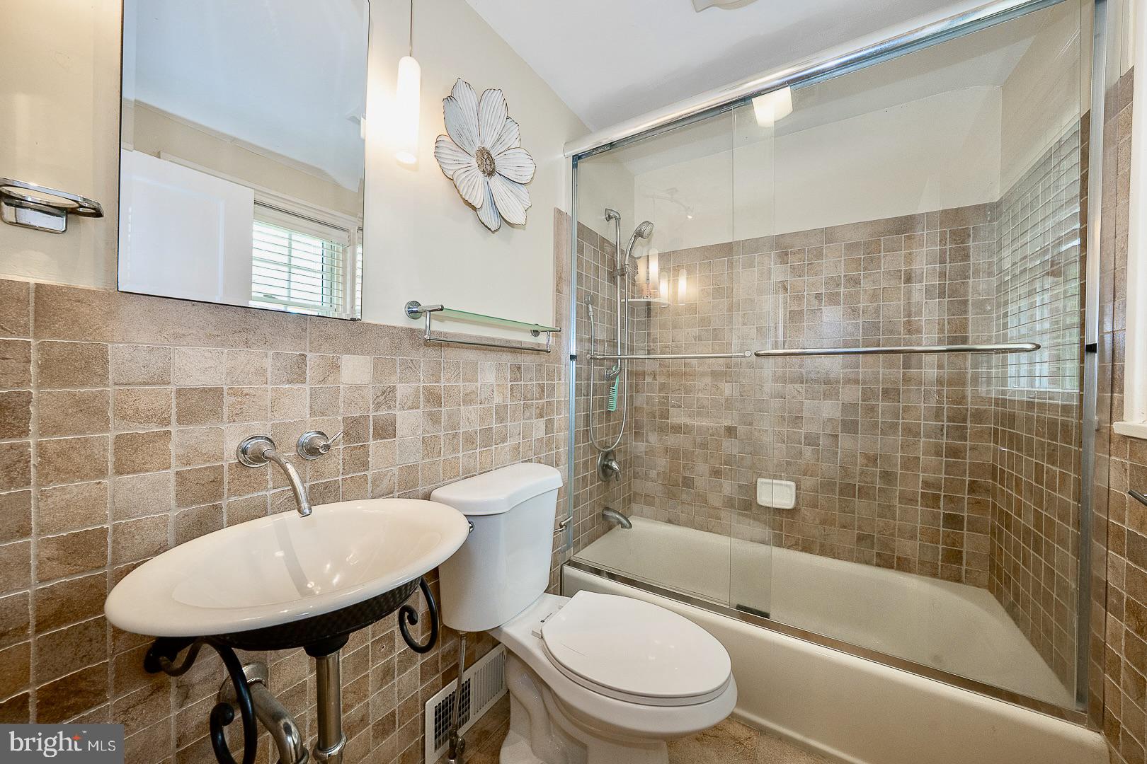 305 Eagle Road Wayne, PA 19087 - Photo 25 of 43 a bathroom with a sink toilet and shower