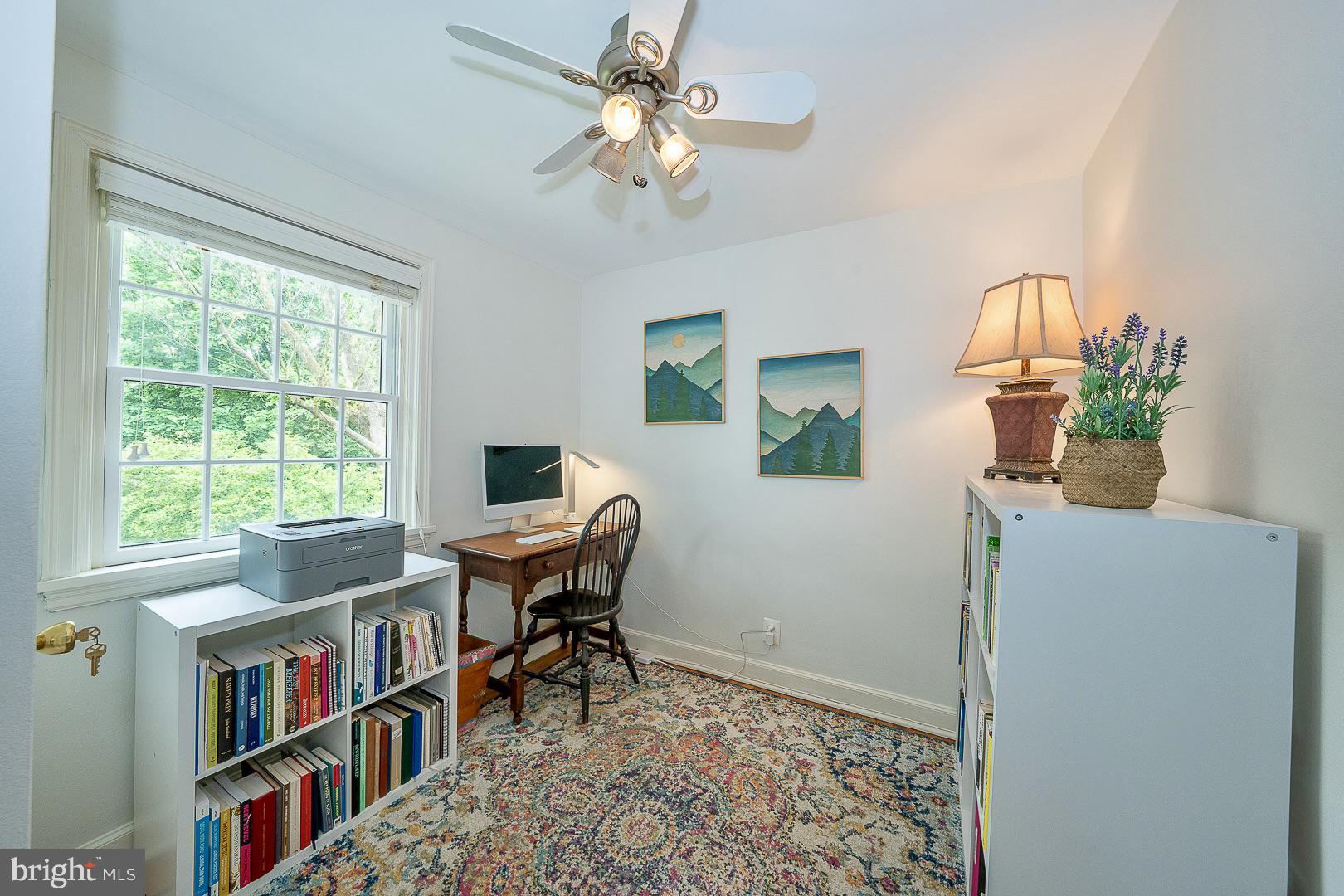 305 Eagle Road Wayne, PA 19087 - Photo 27 of 43 a workspace with furniture bookshelf and a window